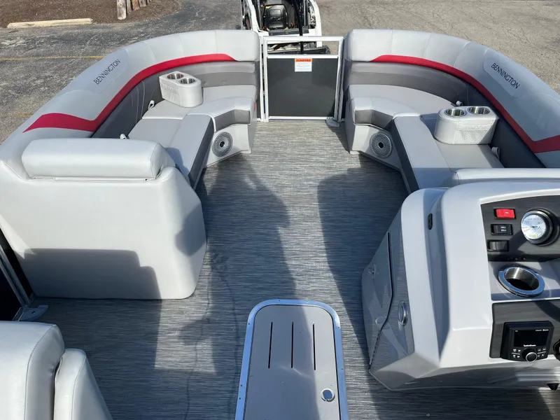 Slide: The Image of 2023 Bennington SX Line pontoon boat interior with gray and red seating. - 11
