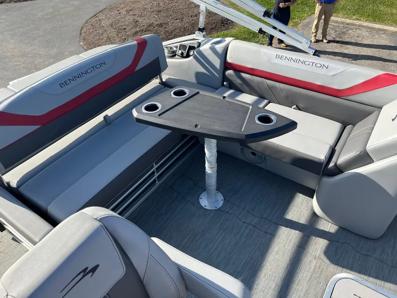 Slide: The Image of 2023 Bennington SX Line boat interior with seating and table. - 6