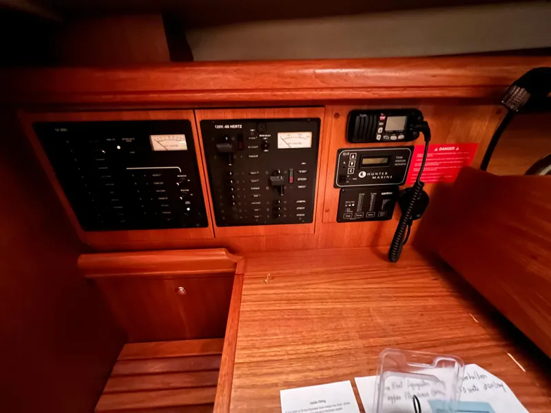 Slide: The Image of Control panel of a 2005 Hunter 38 sailboat with radio and electrical switches. - 27