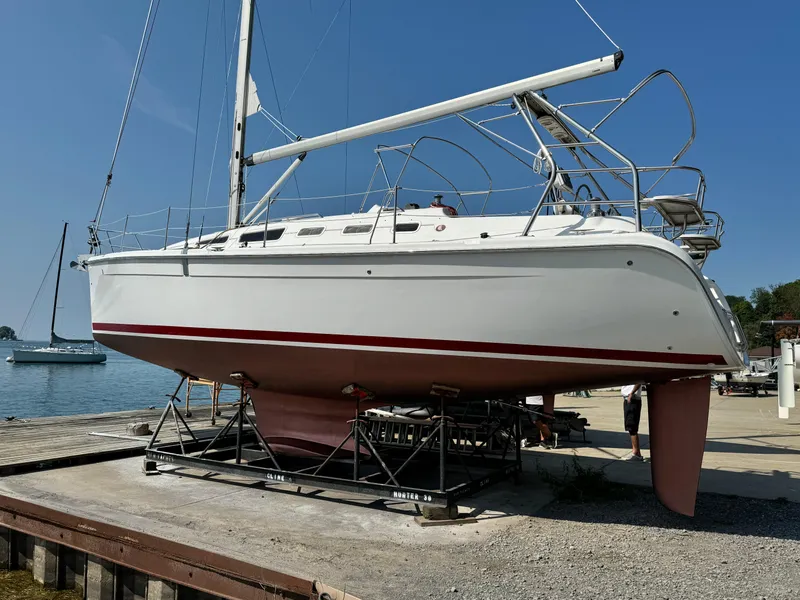 Slide: The Image of 2005 Hunter 38 sailboat on dry dock near waterfront. - 3