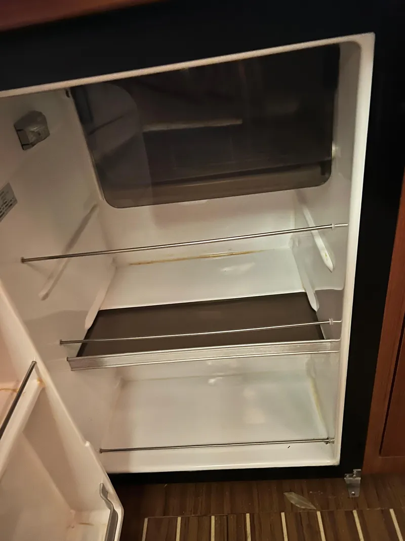 Slide: The Image of Empty refrigerator in a 2005 Hunter 38 sailboat. - 30