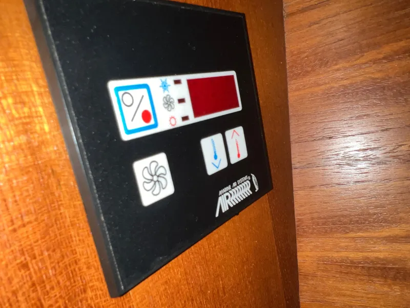 Slide: The Image of Control panel on a 2005 Hunter 38 sailboat with temperature and fan settings. - 31