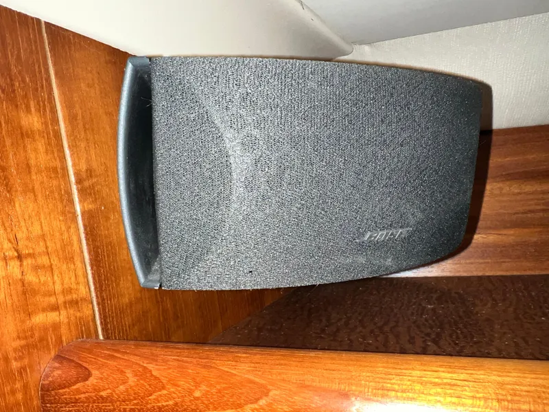 Slide: The Image of Black Bose speaker mounted on wooden interior of 2005 Hunter 38 sailboat. - 32