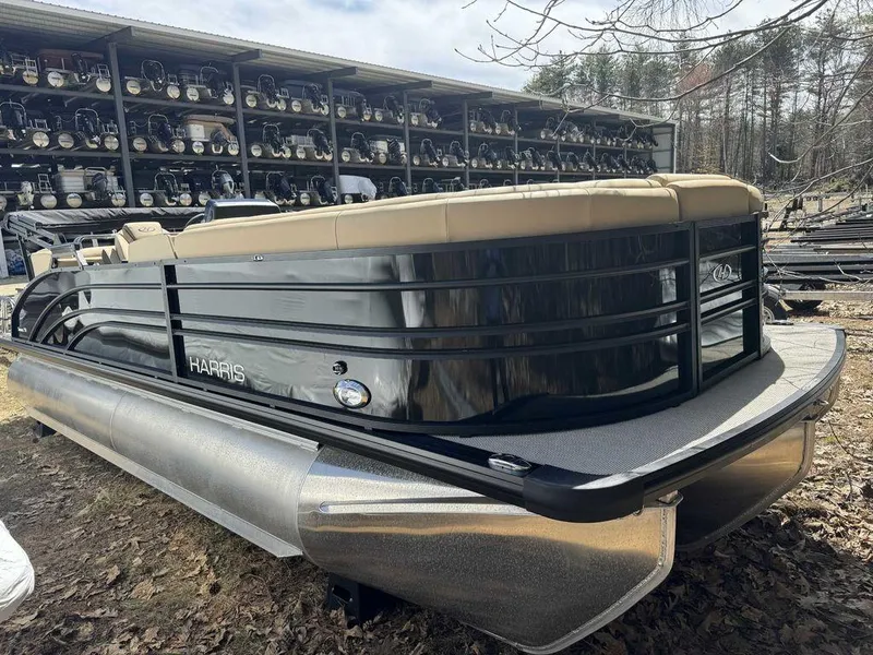 Slide: The Image of 2024 Harris Sunliner 230 pontoon boat in storage yard. - 3
