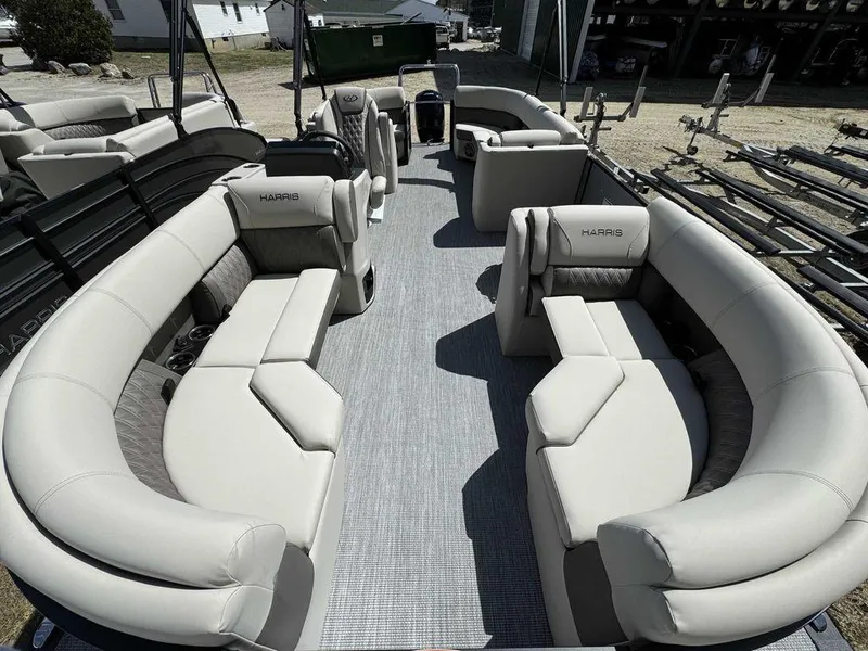 Slide: The Image of 2024 Harris Sunliner 210 pontoon boat with spacious seating and modern design. - 4