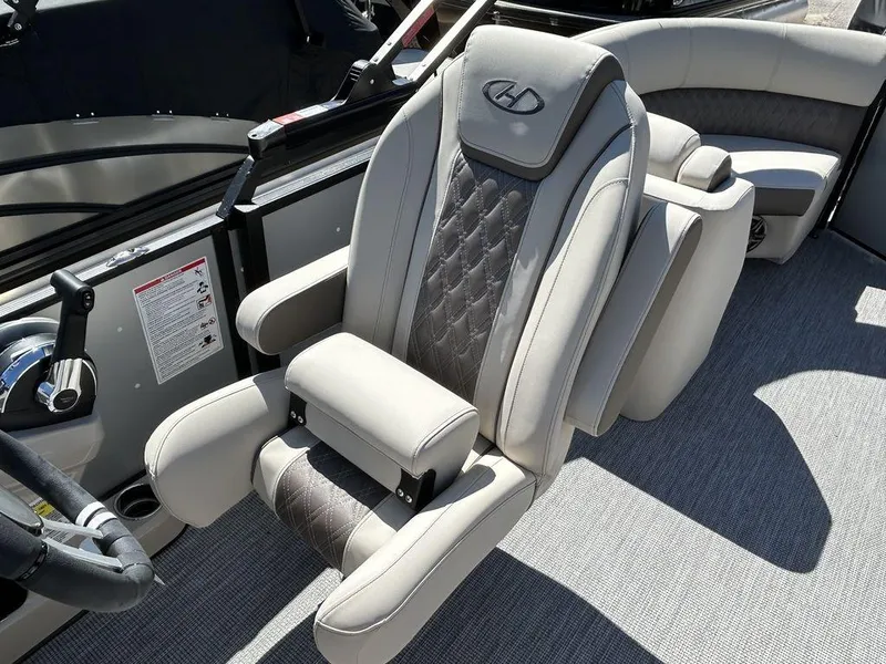 Slide: The Image of 2024 Harris Sunliner 210 boat interior with luxurious seating and modern design. - 12