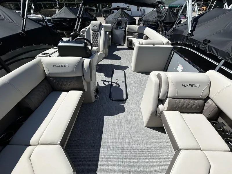 Slide: The Image of 2024 Harris Sunliner 210 pontoon boat interior with luxurious seating and modern design. - 16
