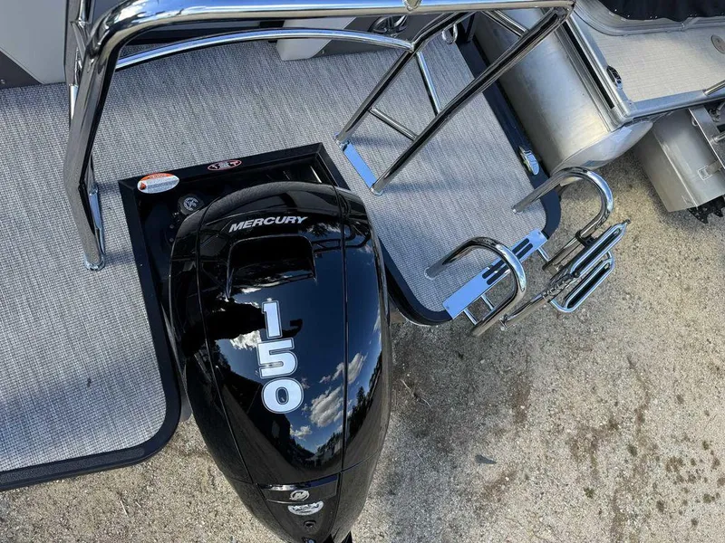 Slide: The Image of 2024 Harris Sunliner 210 with Mercury 150 outboard engine, rear deck view. - 7