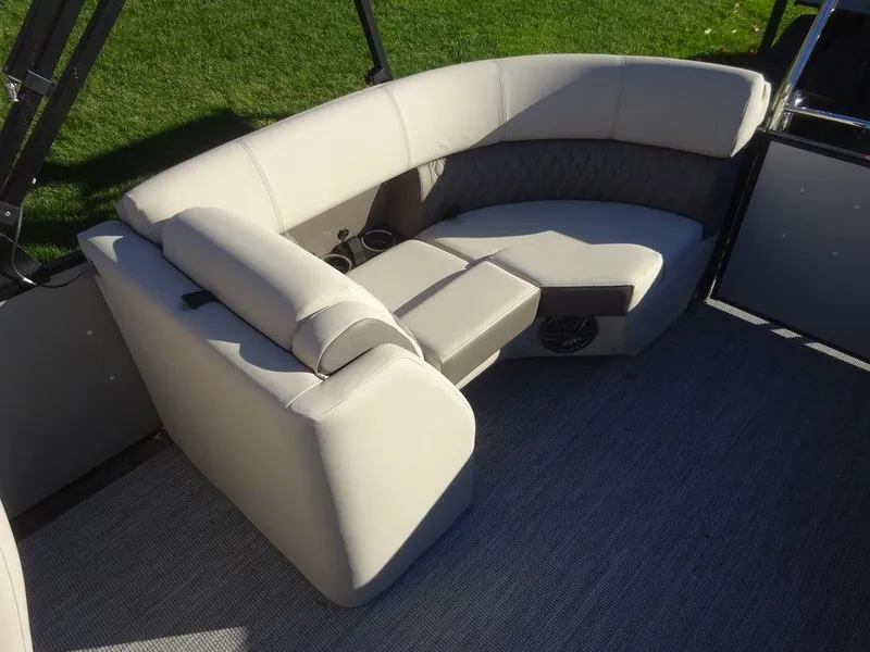 Slide: The Image of 2024 Harris Sunliner 210 boat interior with plush seating and modern design. - 10