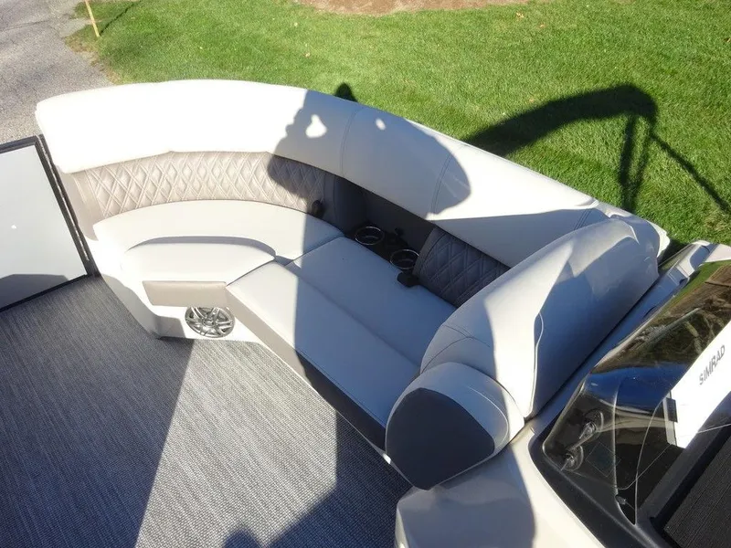 Slide: The Image of 2024 Harris Sunliner 210 boat interior with plush seating and modern design. - 17