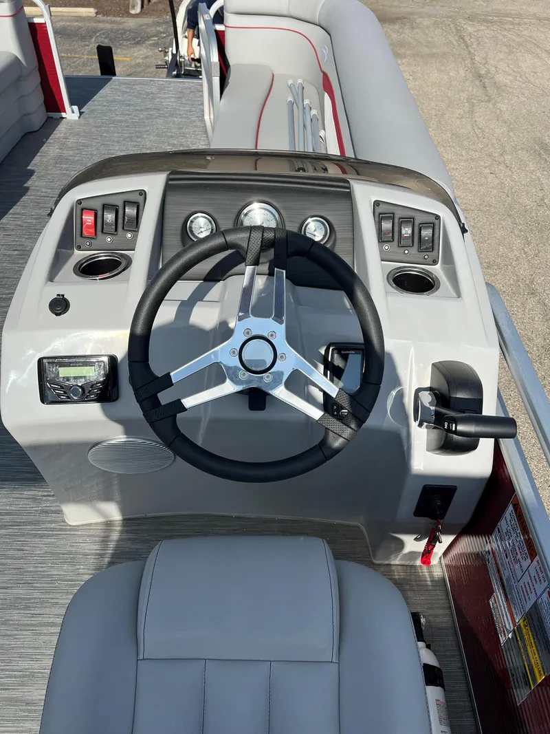 Slide: The Image of 2023 Bennington SV Line boat dashboard with steering wheel and control panel. - 5