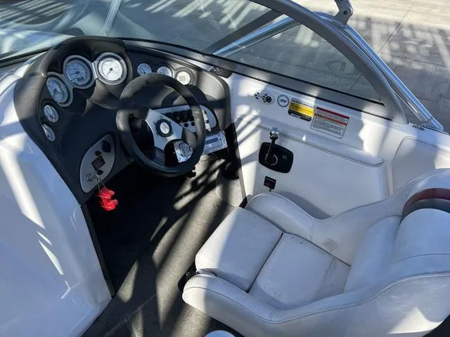 Slide: The Image of 2006 Moomba Outback boat cockpit with steering wheel and gauges. - 11