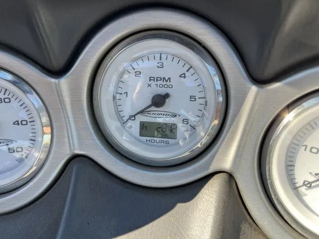 Slide: The Image of 2006 Moomba Outback RPM gauge showing 220.4 hours. - 9