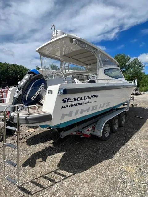 Slide: The Image of 2019 Nimbus W9 boat on a trailer with Evinrude outboard motor. - 0