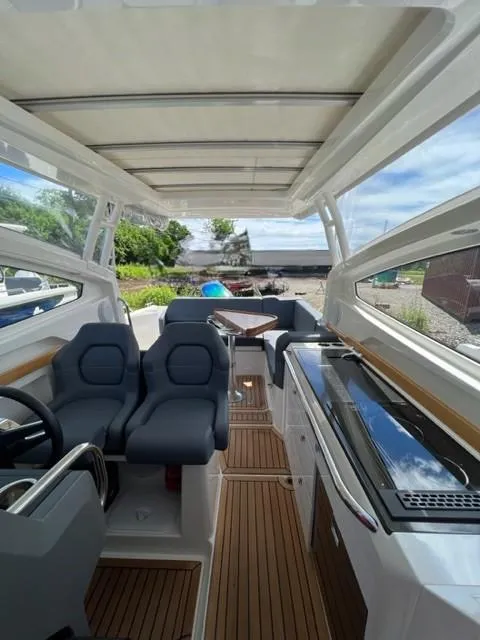 Slide: The Image of Interior of 2019 Nimbus W9 boat with modern seating and kitchen area. - 10