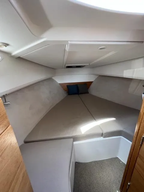 Slide: The Image of 2019 Nimbus W9 boat interior cabin with bed and cushions - 15