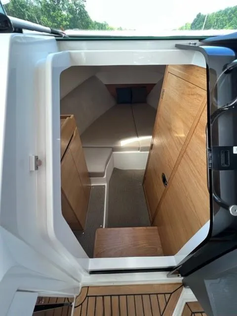 Slide: The Image of Interior cabin of a 2019 Nimbus W9 boat with wooden furnishings. - 17