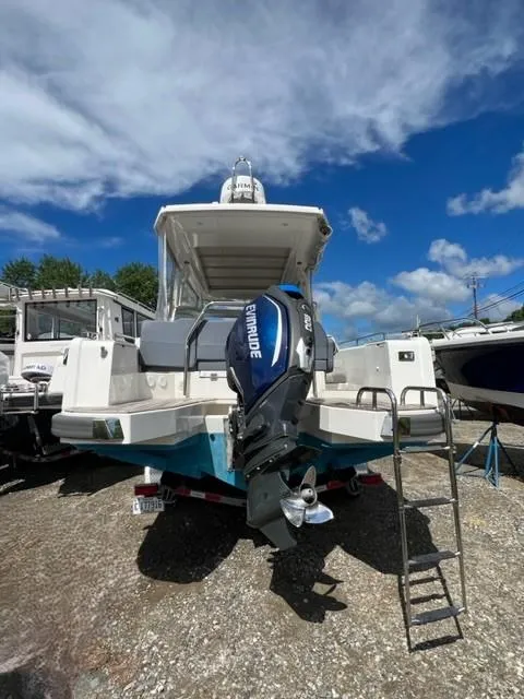 Slide: The Image of 2019 Nimbus W9 boat with Evinrude outboard motor on display. - 2