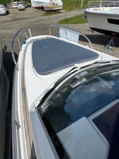 Slide: The Image of 2019 Nimbus W9 boat docked, featuring sleek design and spacious deck. - 6