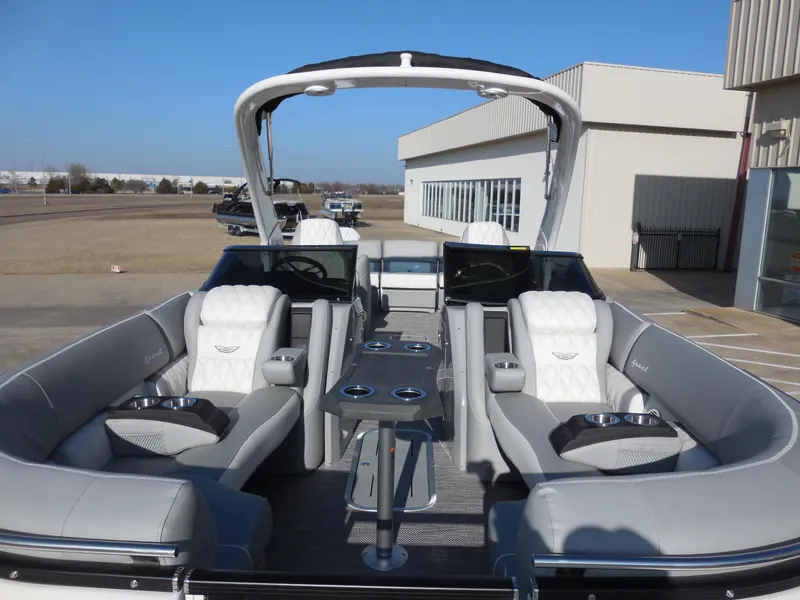Slide: The Image of 2024 Bennington 27 QXFBWAT2 luxury pontoon boat with plush seating and modern amenities. - 4