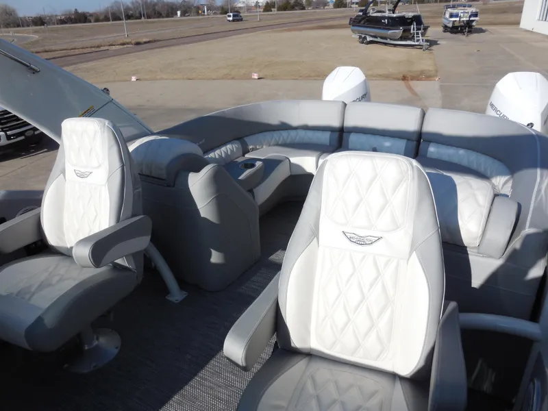 Slide: The Image of 2024 Bennington 27 QXFBWAT2 luxury pontoon boat interior with plush seating. - 6