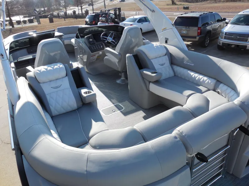 Slide: The Image of 2024 Bennington 27 QXFBWAT2 pontoon boat with luxurious seating and modern dashboard. - 8