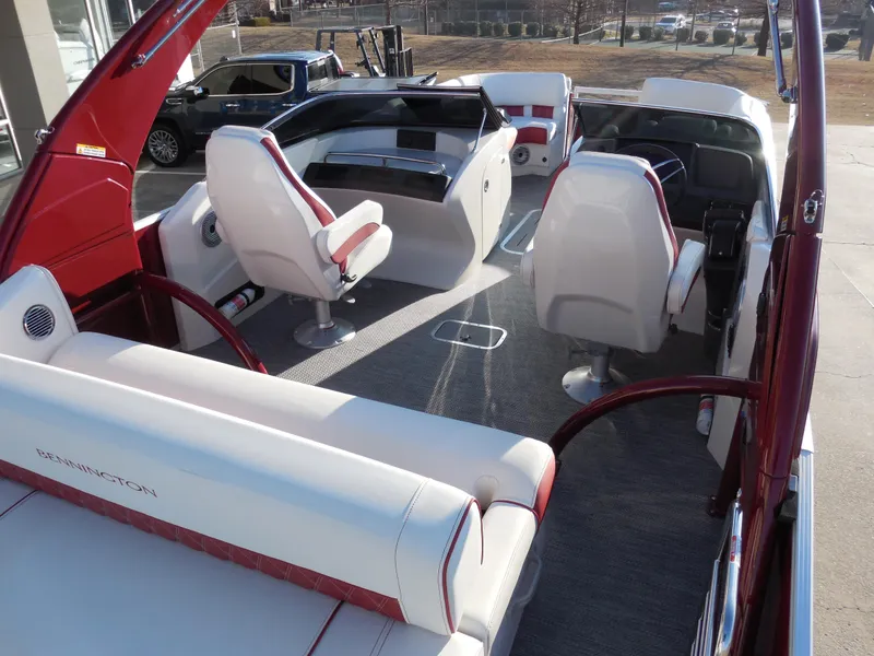 Slide: The Image of 2024 Bennington 27 QSBWAT2 boat interior with white and red seating. - 10
