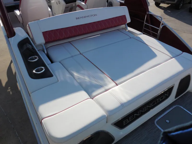 Slide: The Image of 2024 Bennington 27 QSBWAT2 boat with luxurious seating and cup holders. - 8