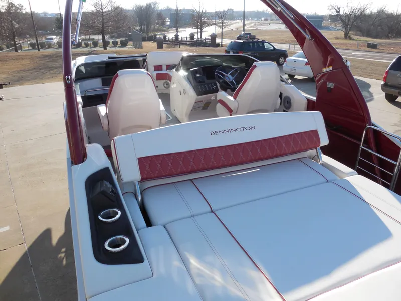 Slide: The Image of 2024 Bennington 27 QSBWAT2 luxury pontoon boat with white and red interior. - 9
