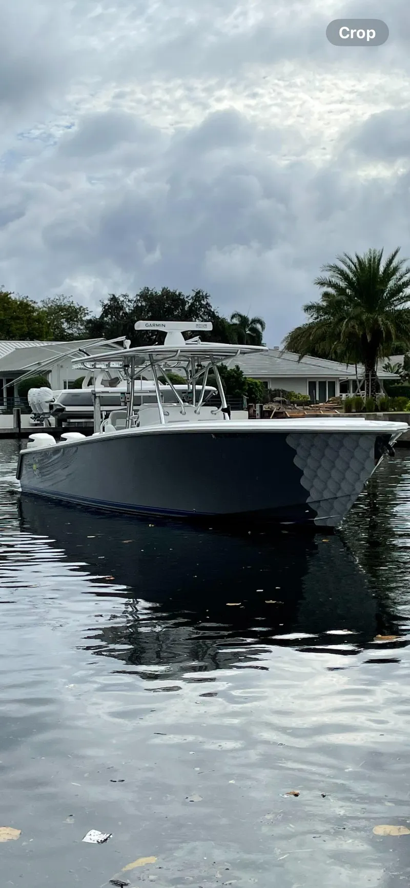 The Image of 2009 Jupiter 38 FS boat docked on a calm waterway. - 1