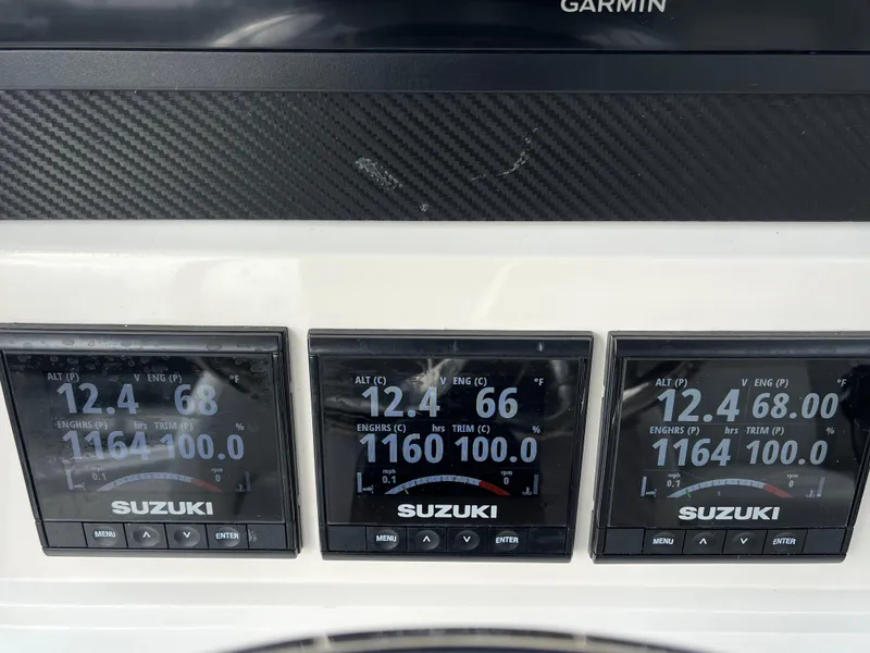 Slide: The Image of Suzuki engine displays on a 2009 Jupiter 38 FS boat. - 17