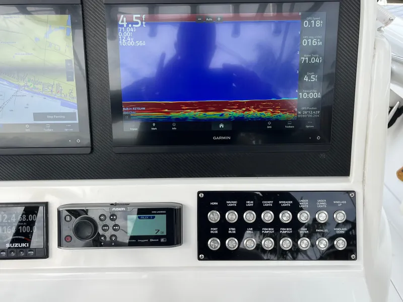 Slide: The Image of Control panel and navigation screens on a 2009 Jupiter 38 FS boat. - 20