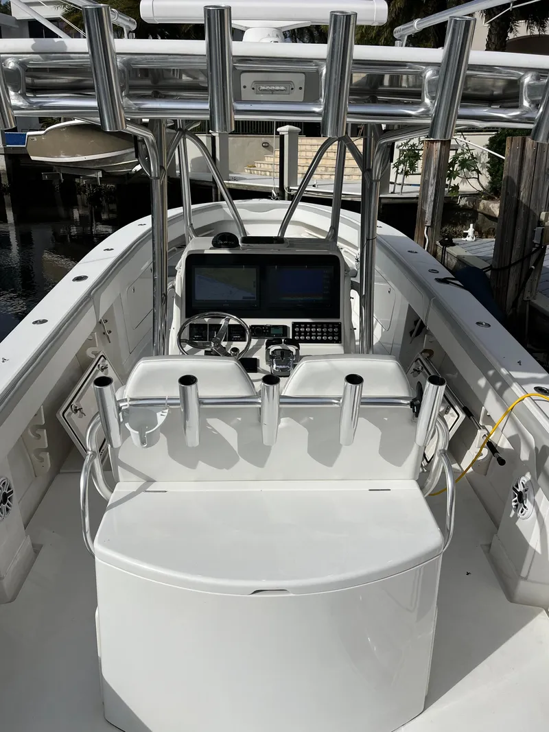 Slide: The Image of 2009 Jupiter 38 FS boat cockpit with advanced navigation system and rod holders. - 22