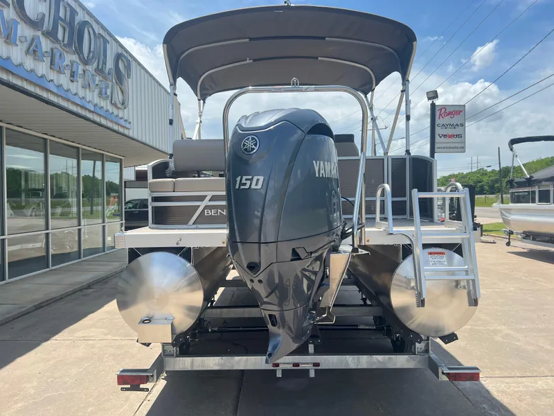 Slide: The Image of 2024 Bennington 22 SSB pontoon boat with Yamaha 150 engine at dealership. - 3