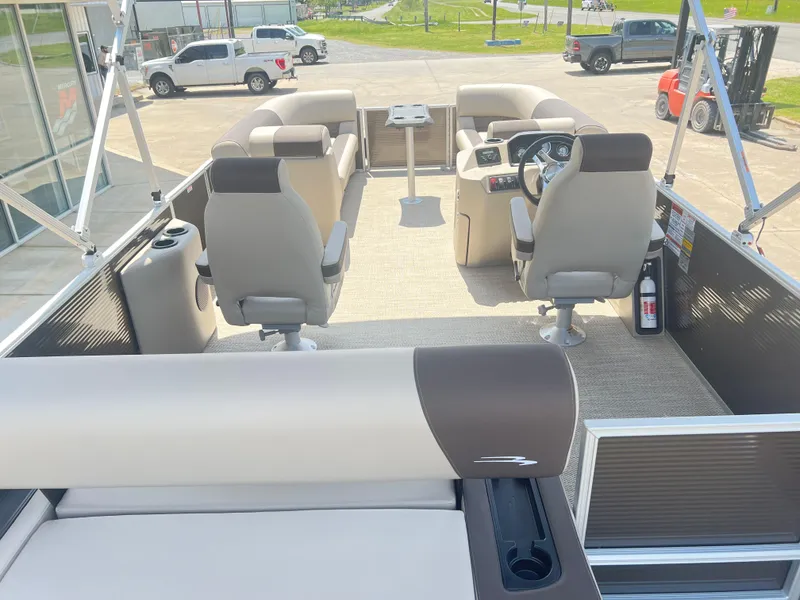 Slide: The Image of 2024 Bennington 22 SSB pontoon boat interior with seating and helm station. - 4