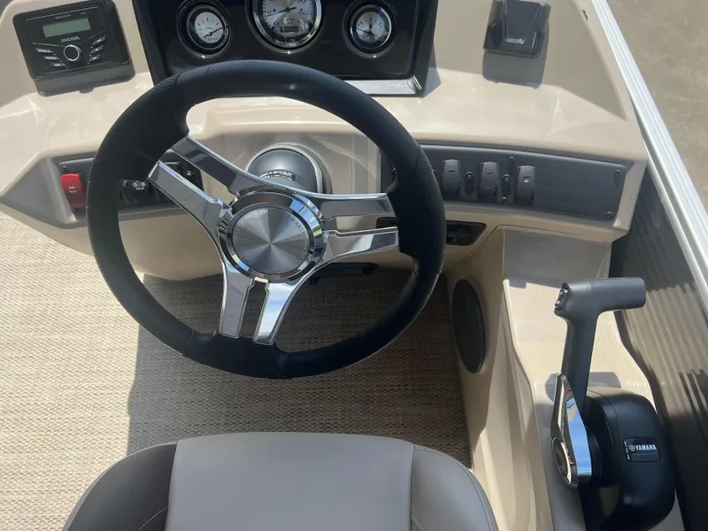 Slide: The Image of 2024 Bennington 22 SSB boat steering wheel and control panel. - 5