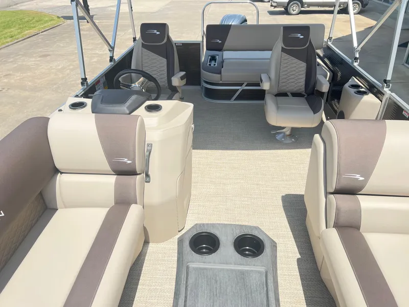 Slide: The Image of 2024 Bennington 22 SSB pontoon boat interior with beige and brown seating. - 7