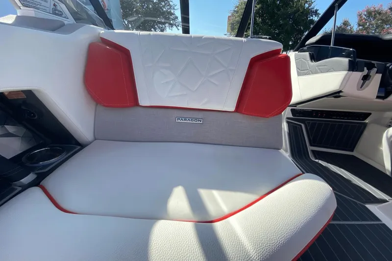 Slide: The Image of Interior seating of 2023 Nautique Super Air Nautique G25 Paragon boat with red and white upholstery. - 26