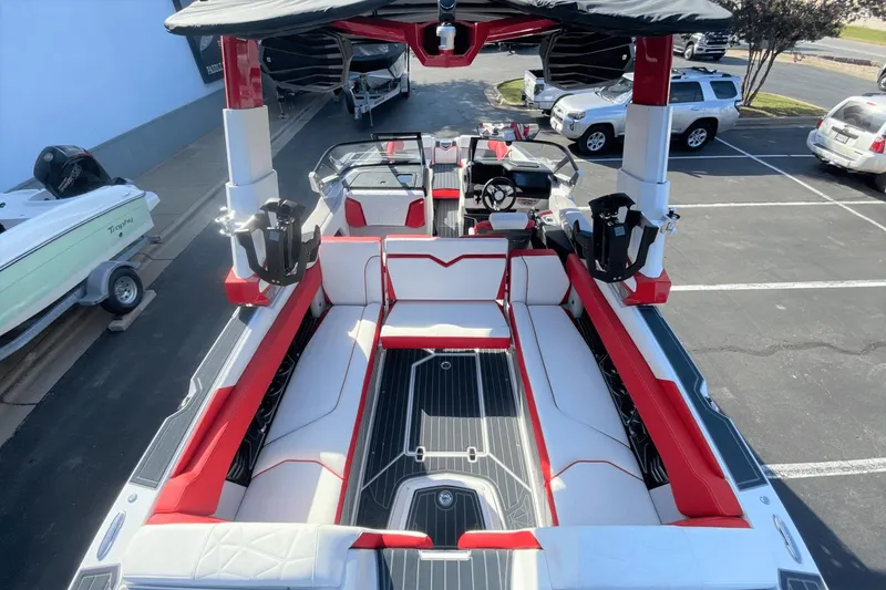 Slide: The Image of 2023 Nautique Super Air Nautique G25 Paragon interior with red and white seating. - 8