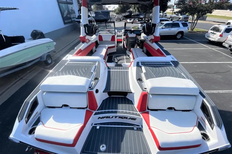Slide: The Image of 2023 Nautique Super Air Nautique G25 Paragon boat interior with red and white seating. - 10