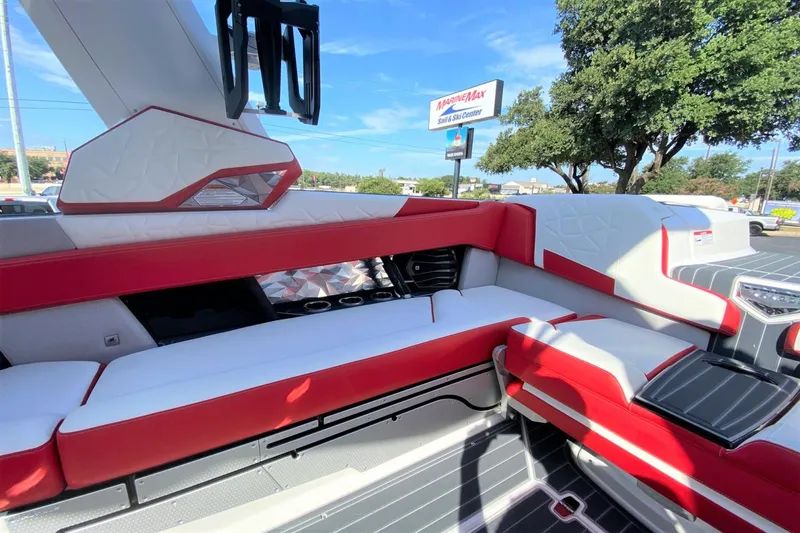 Slide: The Image of Interior of 2023 Nautique Super Air Nautique G25 Paragon boat with red and white seating. - 18