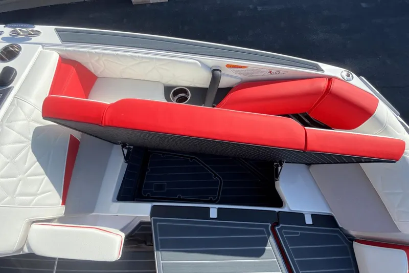 Slide: The Image of 2023 Nautique Super Air Nautique G25 Paragon interior with red and white seating. - 33