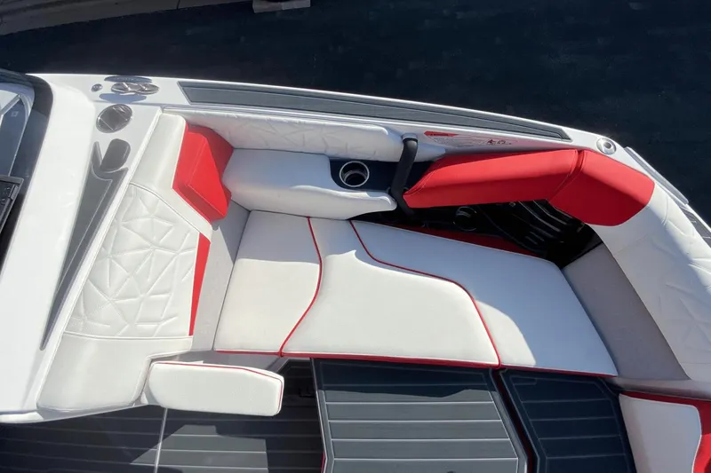 Slide: The Image of 2023 Nautique Super Air Nautique G25 Paragon interior with white and red seating. - 32
