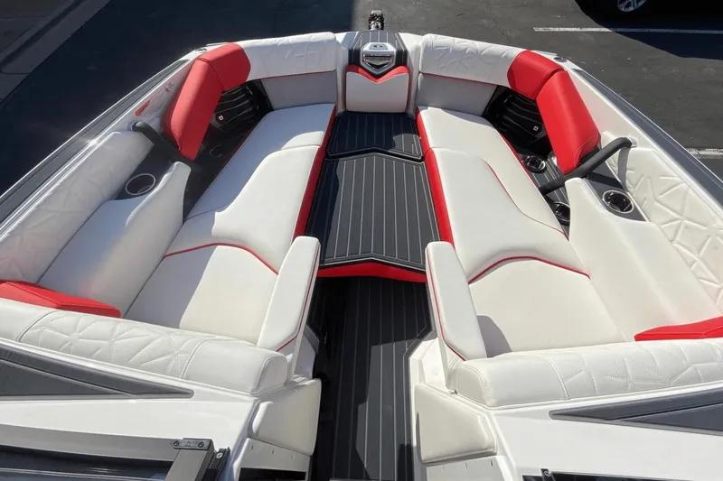 Slide: The Image of Interior seating of 2023 Nautique Super Air Nautique G25 Paragon boat with white and red upholstery. - 27