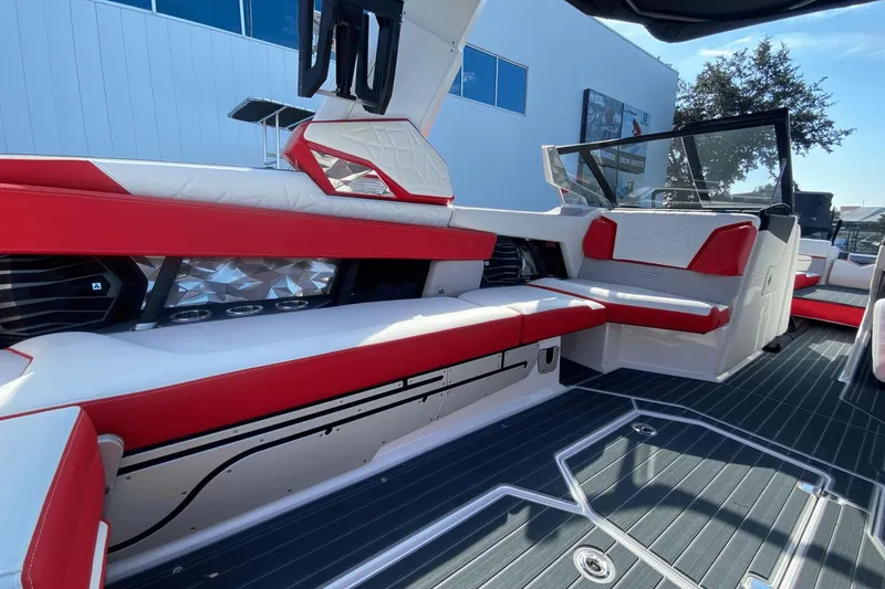 Slide: The Image of Interior of 2023 Nautique Super Air Nautique G25 Paragon with red and white seating. - 24