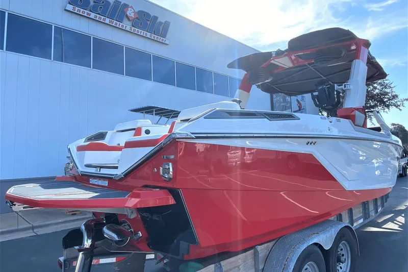 Slide: The Image of 2023 Nautique Super Air Nautique G25 Paragon boat in red and white at Sail & Ski Center. - 6