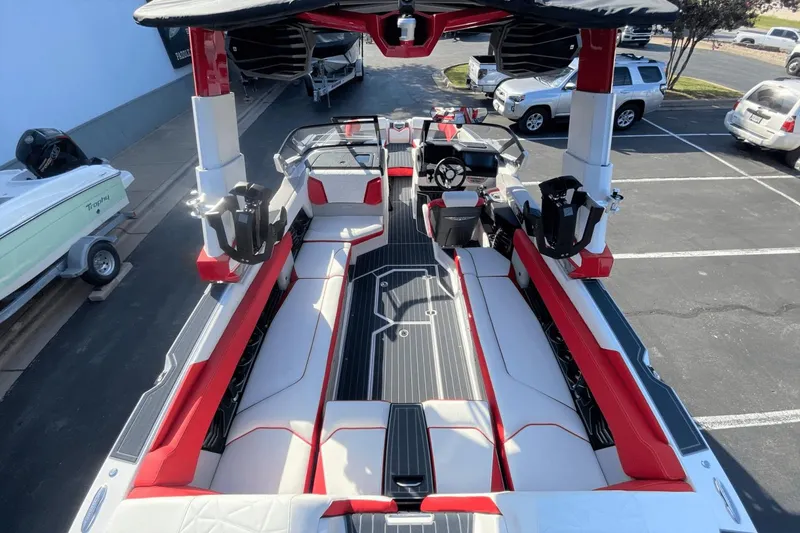 Slide: The Image of 2023 Nautique Super Air Nautique G25 Paragon interior with red and white seating. - 7
