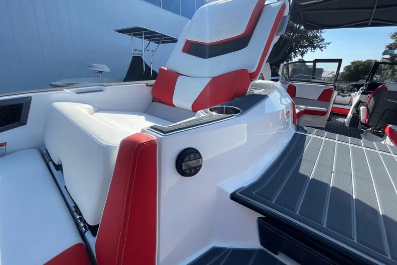 Slide: The Image of 2023 Nautique Super Air Nautique G25 Paragon interior with red and white seating. - 13