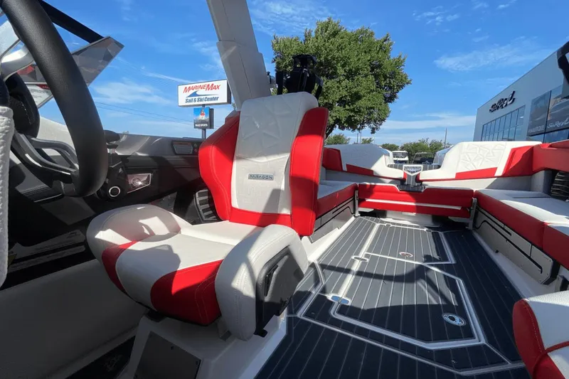 Slide: The Image of 2023 Nautique Super Air Nautique G25 Paragon interior with red and white seating. - 34