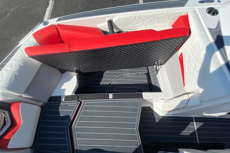 Slide: The Image of 2023 Nautique Super Air Nautique G25 Paragon interior with red and white seating. - 29